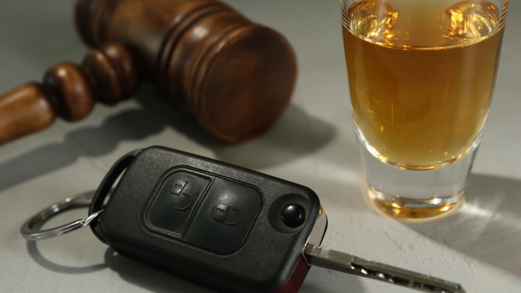 car key, alcohol, and judge gavel